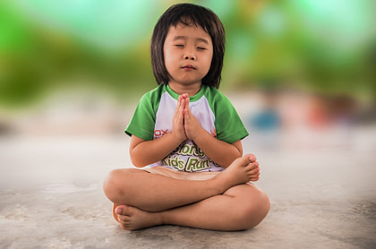 Small girl meditating