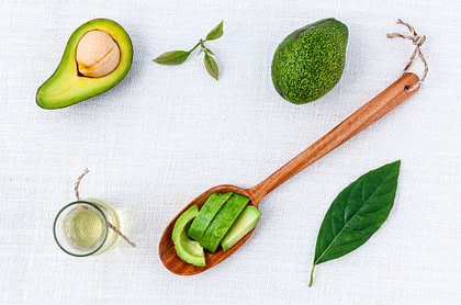 Healthy fats and avocado on white background