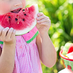 A girl eating watermelon