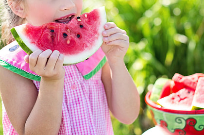 A girl eating watermelon