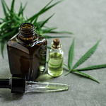 CBD oil and cannabis leaves