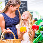 Mother and daughter buying healthy food in the supermarket